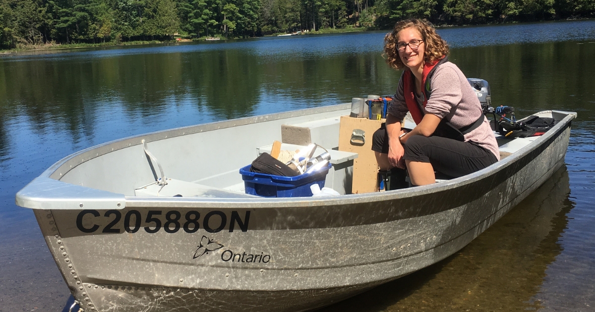 Brittany Welsh sits in a boat on a lake