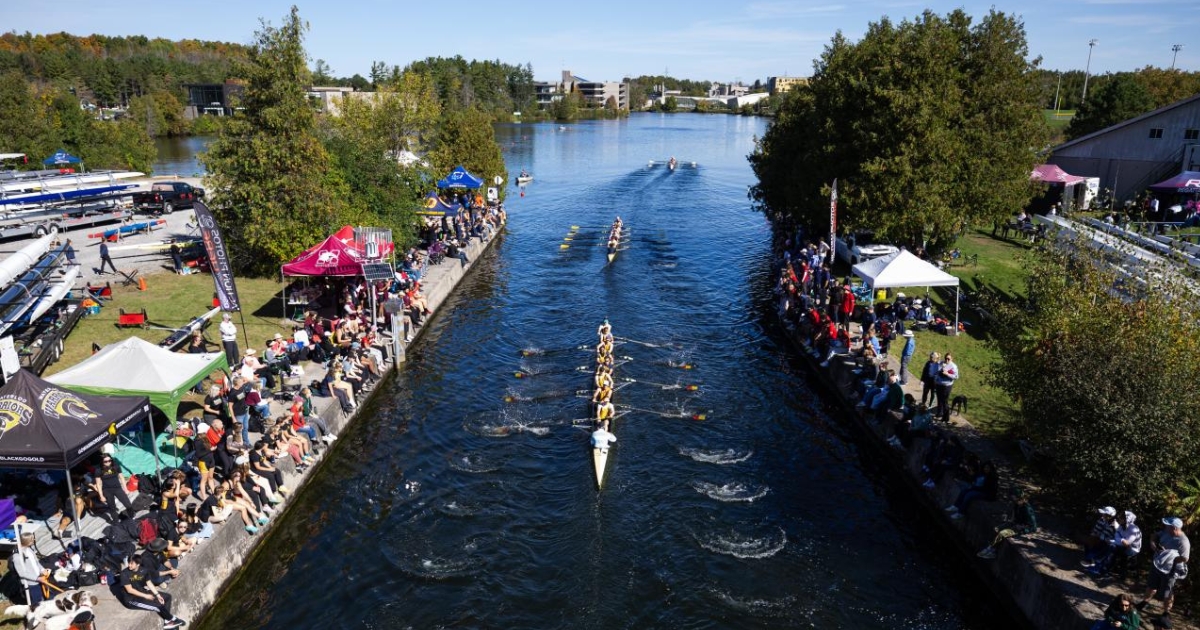 People line the shoreline at Trent to watch rowers during Head of the Trent