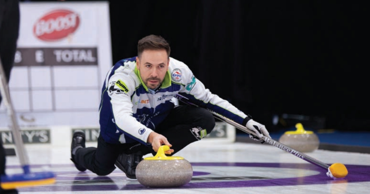 John Epping crouches down while curling.