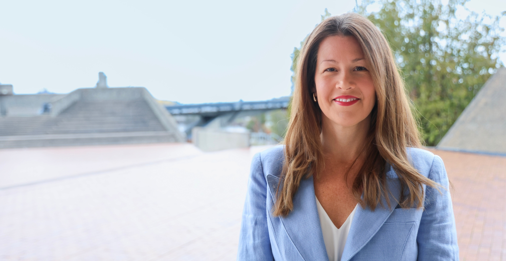 Sandy Marett standing outside in front of Trent University