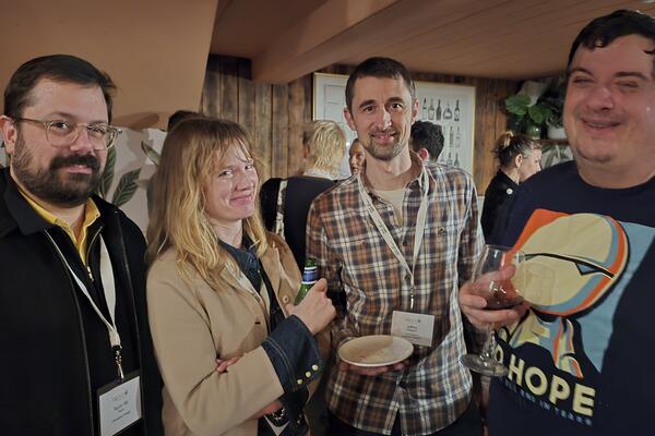 4 alumni at a London social event