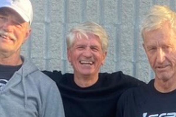 Jamie Fleming smiling next to friends