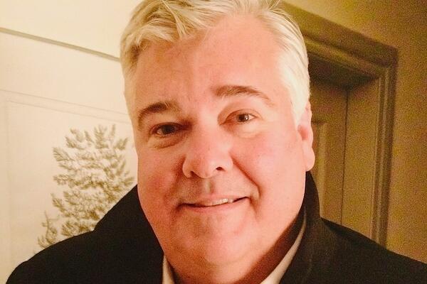 A man smiling at the camera