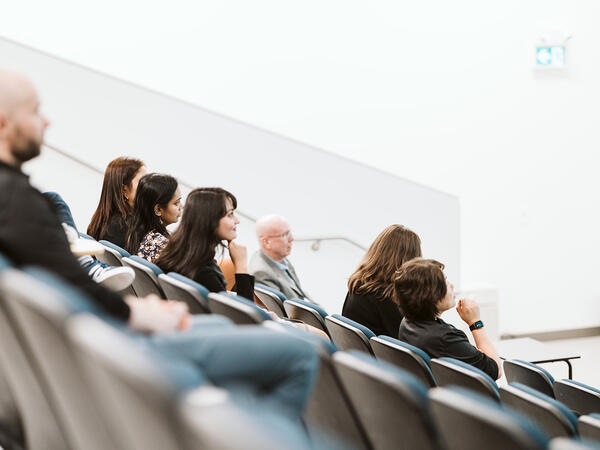 Group of people sitting in a lecture hall