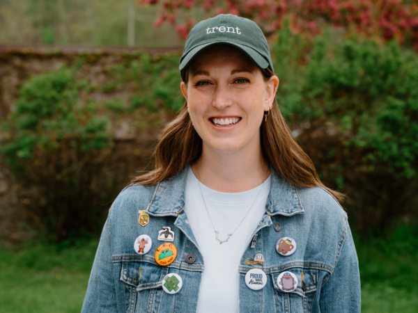 Alumni wearing pins from all colleges at Trent 