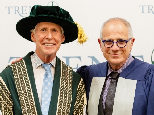 Stephen Stohn stands next to Bob Ezrin in their Convocation gowns