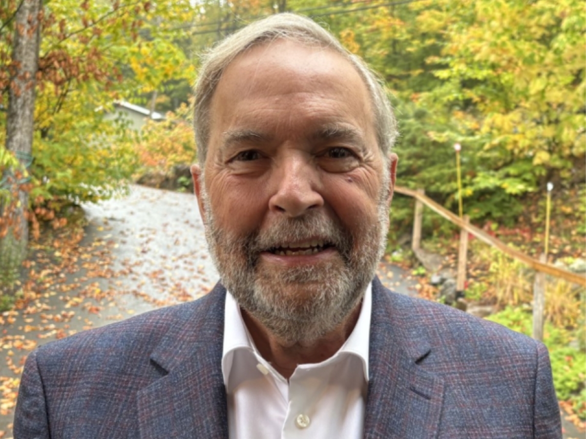 Photo of Tom Mulcair standing outside