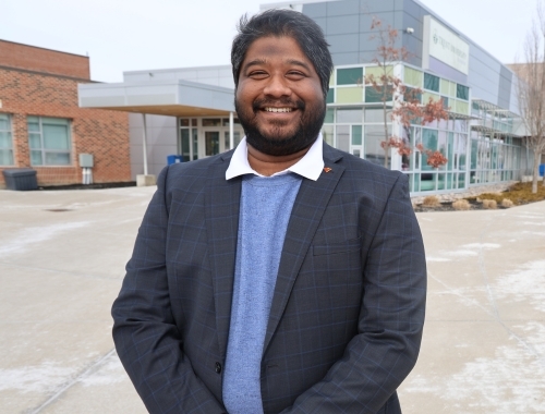 Chandra Narra smiling on the Trent Durham GTA campus
