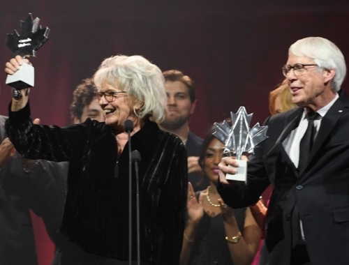 Linda Schuyler and Stephen Stohn hold up their Canada Walk of Fame awards