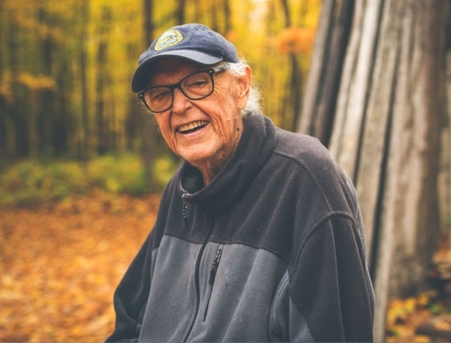 Doug Williams smiles with Fall colours in the background
