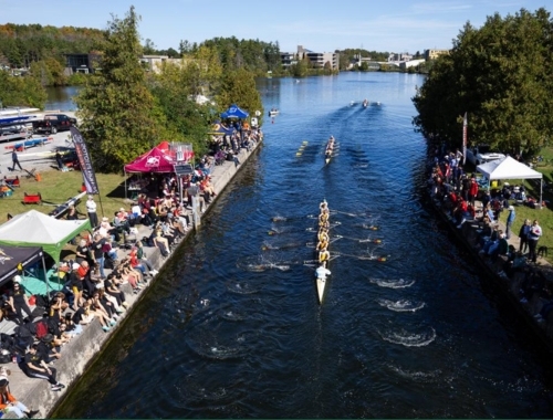 People line the shoreline at Trent to watch rowers during Head of the Trent
