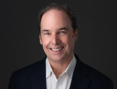 Jeffery McDonnell smiling in a blazer