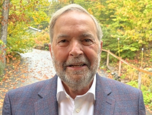 Thomas Mulcair with a backdrop of autumn leaves