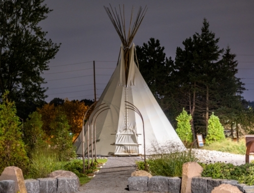 A tipi on Trent's campus at dusk