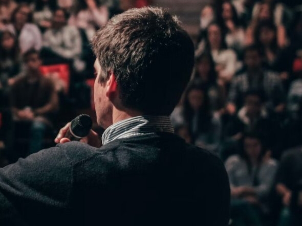 speaker facing a crowd