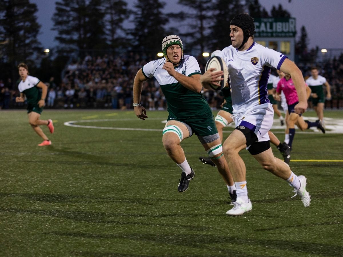 Two rugby players in action