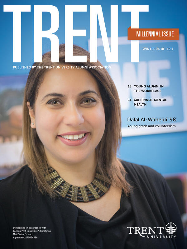 Dalal Al-Waheidi smiling on the cover of the magazine