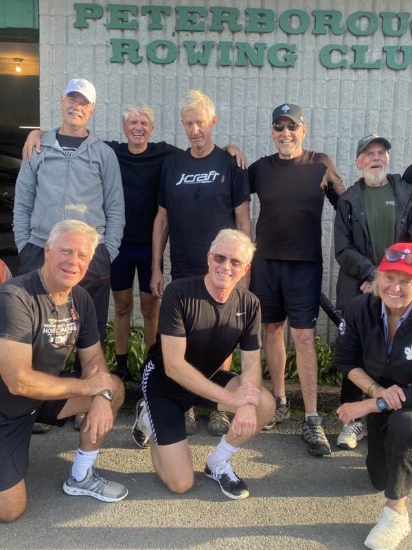 Jamie Fleming smiling next to friends