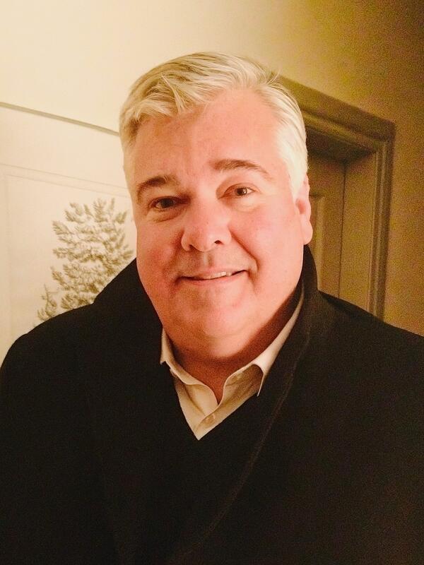 A man smiling at the camera