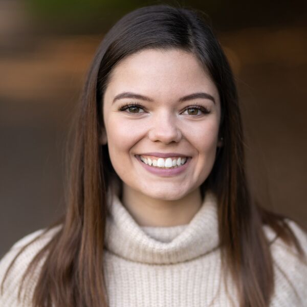 Women with brown hair smiling