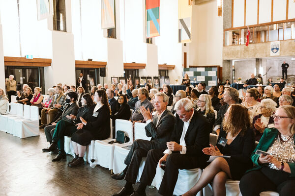 An audience of people in the Great Hall at the Alumni Awards 