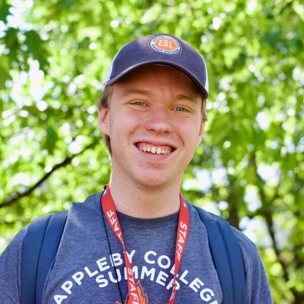 Man with hat on smiling