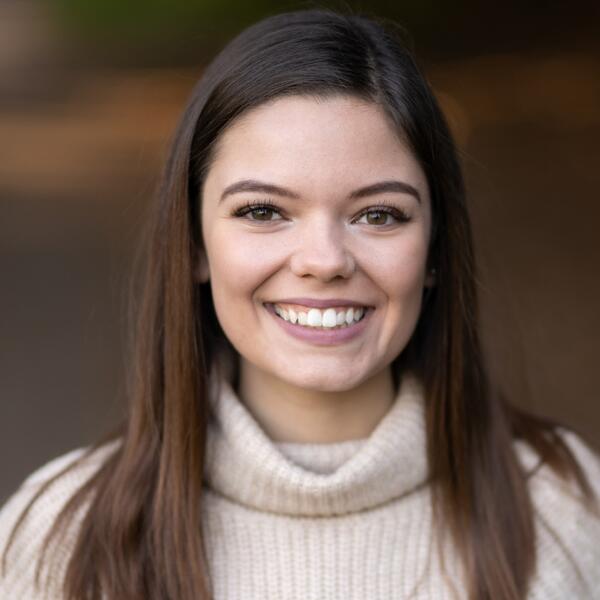 Women with brown hair smiling
